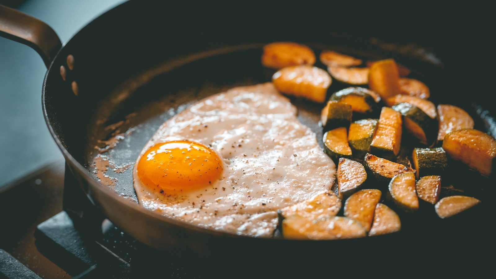 a frying pan filled with eggs and vegetables